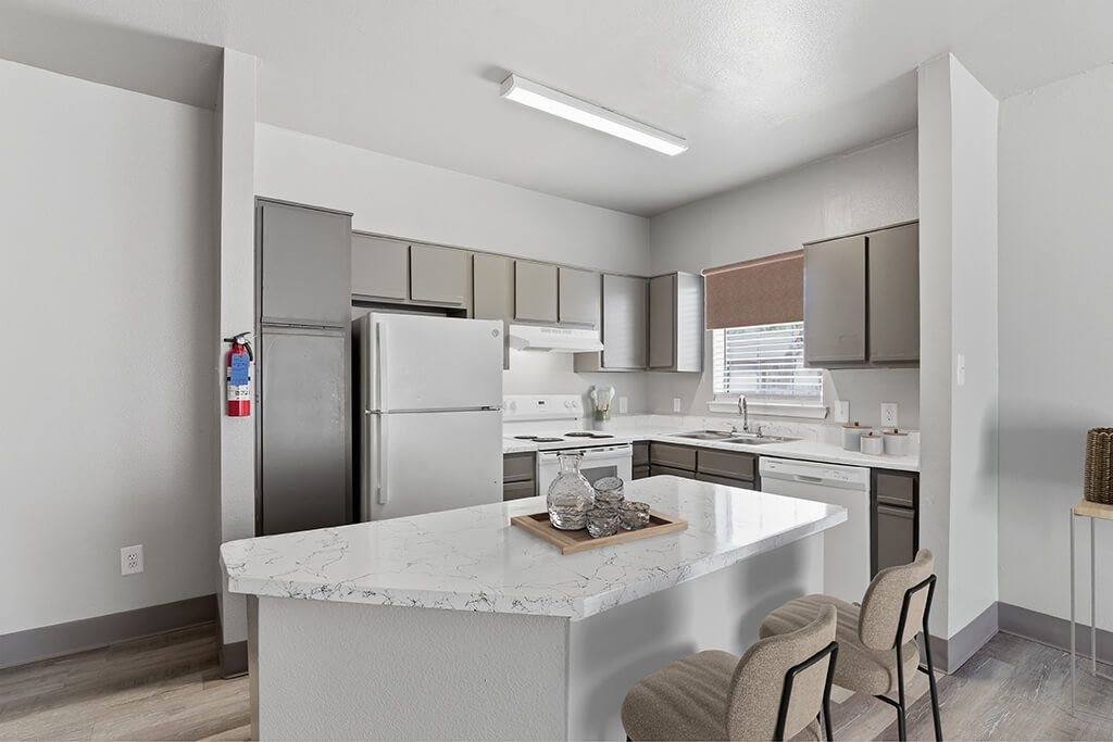 White kitchen countertops at Almeda Park Apartments in Houston TX